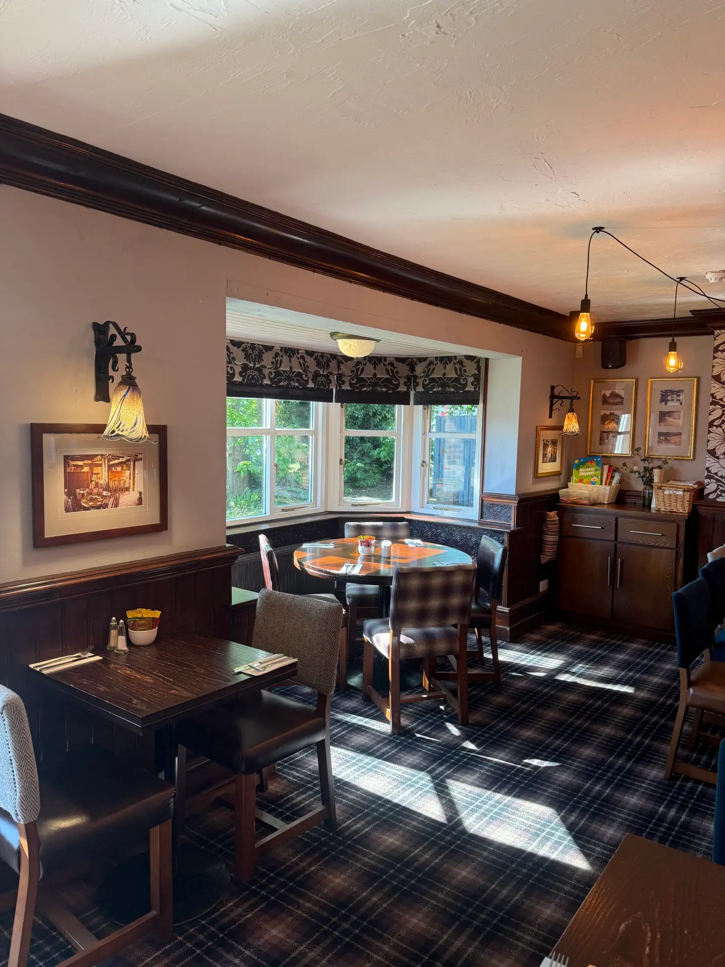 The dining room at The Gamekeeper Scotter with its bay window
