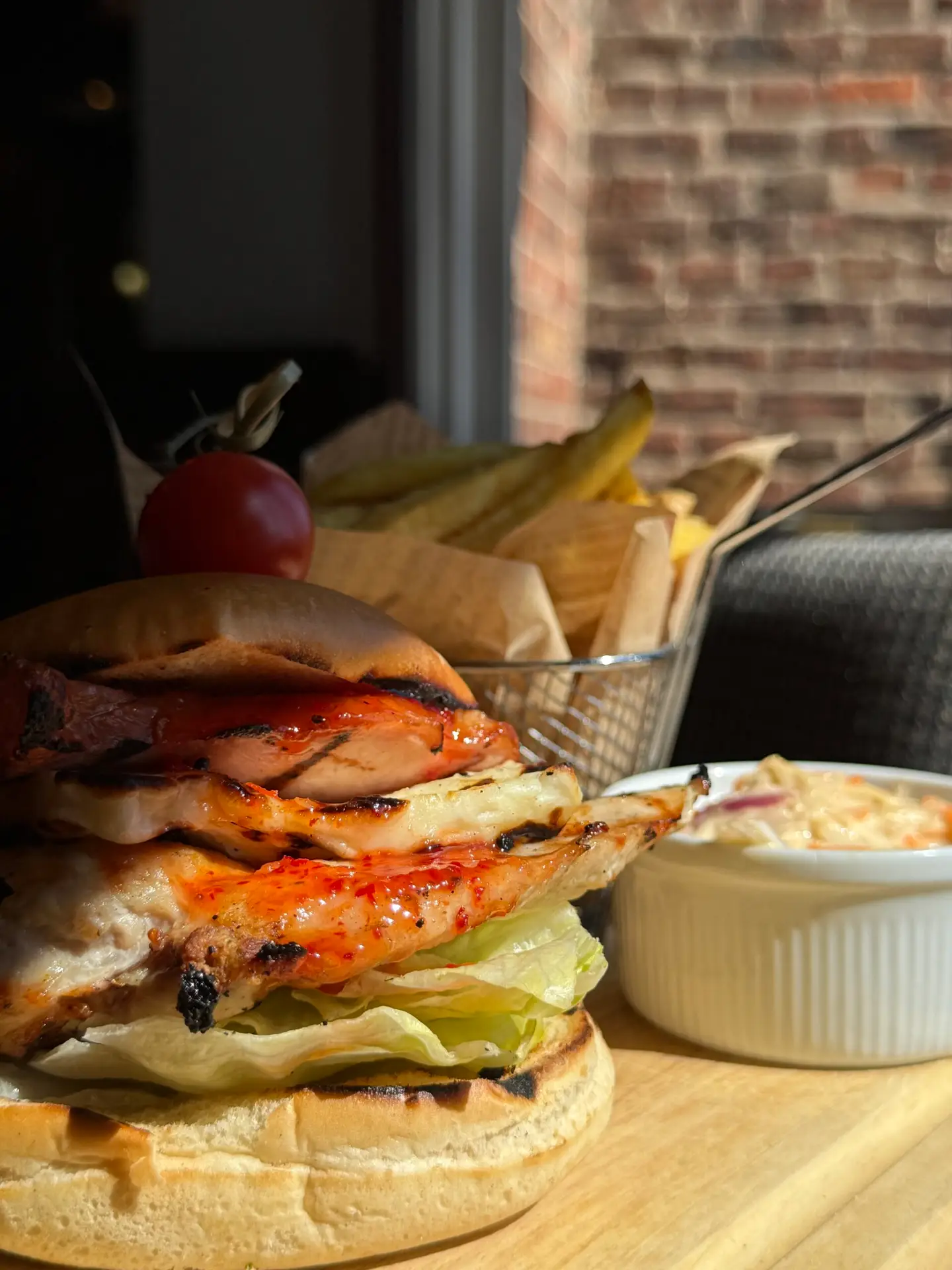 Peri peri chicken burger with chips and coleslaw at The Gamekeeper Scotter